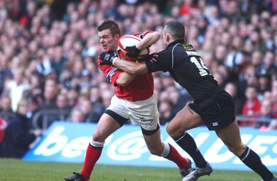 010203 - Neath v Munster - Celtic League Final -  Munster's Mossie Lawlor is tackled by Gareth Morris