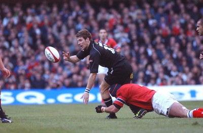 010203 - Neath v Munster - Celtic League Final -  Neath's James Storey is tackled by Alan Quinlan