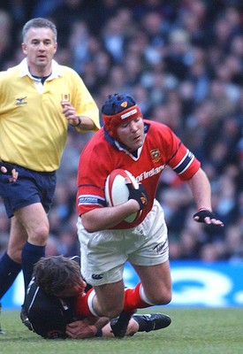 010203 - Neath v Munster - Celtic League Final -  Munster's Anthony Foley is tackled by Andy Moore