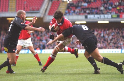 010203 - Neath v Munster - Celtic League Final -  Munster's Mick O'Driscoll is tackled by Nathan Bonner-Evans(8) and Lee Jarvis