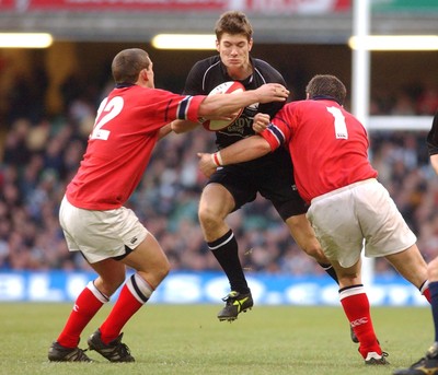 010203 - Neath v Munster - Celtic League Final -  Neath's James Storey is tackled by Jason Holland and Marcus Horan