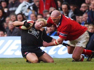 010203 - Neath v Munster - Celtic League Final -  Neath's Shane Williams is stopped by Frankie Sheahan