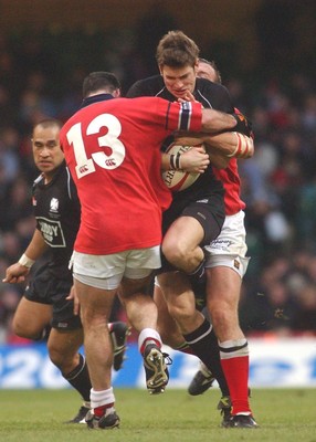 010203 - Neath v Munster - Celtic League Final -  Neath's James Storey runs into Mike Mullins