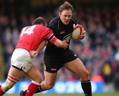 010203 - Neath v Munster - Celtic League Final - Neath's Nathan Bonner-Evans holds off John Kelly