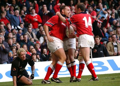 010203 - Neath v Munster - Celtic League Final - Munster's Killian Keane is congratulated by John Kelly (rt) as Neath's Shane Williams (left) recovers