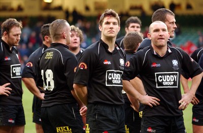 010203 - Neath v Munster - Celtic League Final - Neath's James Storey and Lee Jarvis (left) watch as Munster celebrate