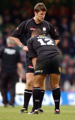 010203 - Neath v Munster - Celtic League Final - Neath's James Storey and Dave Tiueti comfort each other as Munster celebrate