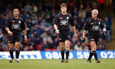 010203 - Neath v Munster - Celtic League Final - Neath's Dave Tiueti (left) and James Storey look at the score at full-time as an emotional Shane Williams (rt) contemplates loss