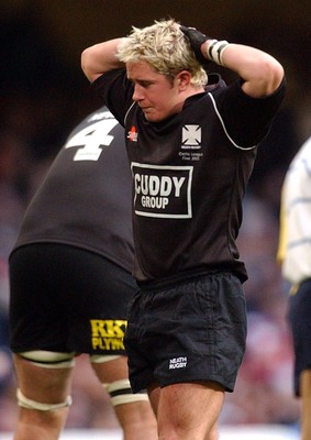 010203 - Neath v Munster - Celtic League Final - A dejected Shane Williams ponders game as Munster celebrate