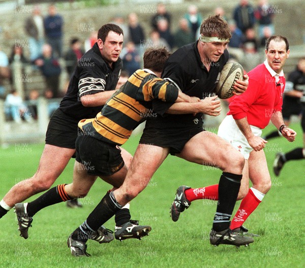 190497 - Neath v Newport - Steve Williams of Neath is tackled by Nicky Lloyd