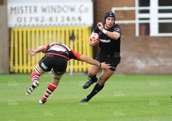 08.10.11 Neath RFC v Pontypool RFC - Principality Premiership - Neath's Luke Ford steps inside Pontypool's Craig Attwell 