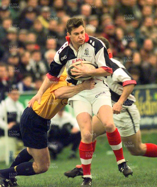 061297 - Neath v Pontypridd - Gareth Wyatt of Pontypridd is tackled by Patrick Horgan