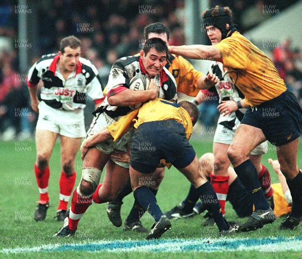 061297 - Neath v Pontypridd - Dale McIntosh of Pontypridd drives into Patrick Horgan