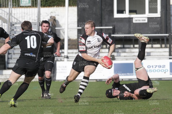 240312 Neath v Pontypridd - Swalec Cup - Pontypridd's Chris Clayton slips past one tackle