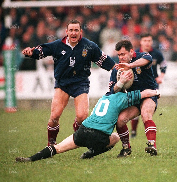 250395 - Neath v Swansea - Aled Williams of Swansea is tackled by Matthew McCarthy