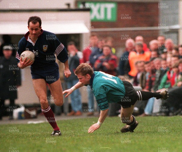 250395 - Neath v Swansea - Simon Davies of Swansea makes a break past James Reynolds