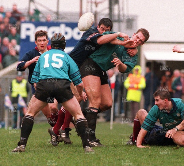 250395 - Neath v Swansea - Paul Arnold of Swansea gets to grips with Gareth Llewellyn