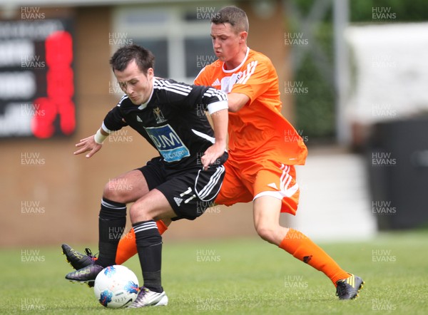 16.07.11 - Neath v Swansea City, pre-season friendly -  Swansea's Scott Tancock tangles with Neaths Kerry Morgan 