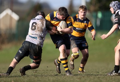 010325 - Nelson Nomads v Aberdare Athletic - WRU Athletic Mid District Division A - Rhys Turner of Aberdare is tackled by Kian Downes of Nelson 