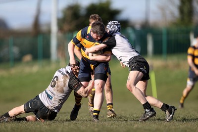 010325 - Nelson Nomads v Aberdare Athletic - WRU Athletic Mid District Division A - Rhys Turner of Aberdare is tackled by Kian Downes of Nelson 