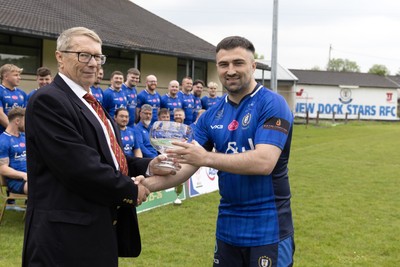 090526 - New Dock Stars - Admiral National League 3 West Trophy Presentation - Chris Jones of the WRU presents the trophy to Captain Jordan Williams 