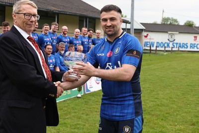 090526 - New Dock Stars - Admiral National League 3 West Trophy Presentation - Chris Jones of the WRU presents the trophy to Captain Jordan Williams 