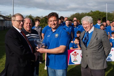 260425 - New Dock Stars League Trophy Presentation - Admiral National League 4 West B - WRU representative Chris Jones presents the trophy to New Dock Stars captain Jonny Harris