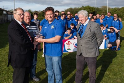 260425 - New Dock Stars League Trophy Presentation - Admiral National League 4 West B - WRU representative Chris Jones presents the trophy to New Dock Stars captain Jonny Harris