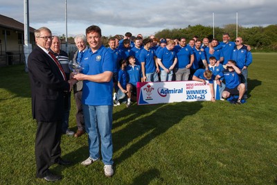 260425 - New Dock Stars League Trophy Presentation - Admiral National League 4 West B - WRU representative Chris Jones presents the trophy to New Dock Stars captain Jonny Harris