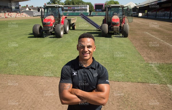 050717 - Dragons rugby star Ashton Hewitt takes a closer look as work starts on removal of the old pitch at Rodney Parade, Newport, in preparation for the installation of a new hybrid pitch