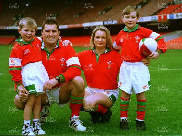 251193 - Picture shows Welsh rugby player Mike Griffiths with his wife Anne and children Joel and Luc at the Cardiff Arms Park modelling the new kit