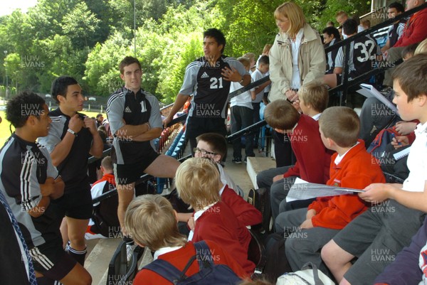 04.06.08..New Zealand under 20 team training at Sardis Road ,Pontypridd -New Zealand under 20 players with local school chilren  