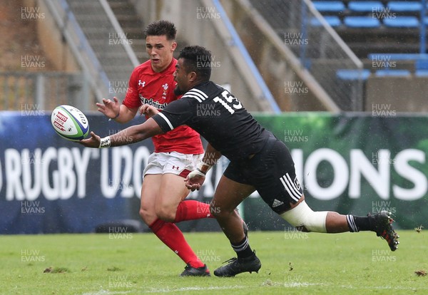 030618 - New Zealand U20 v Wales U20, World Rugby U20 Championship 2018, Pool A - Dewi Cross of Wales and Vilimoni Koroi of New Zealand compete for the ball