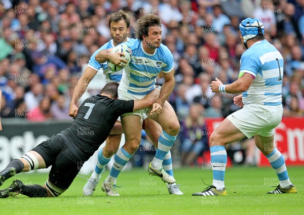 200915  - New Zealand vs Argentina -  IRB Rugby World Cup 2015 Group C -Richie McCaw of New Zealand tackles Argentina's Marcelo Bosch