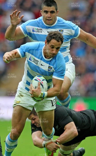 200915  - New Zealand vs Argentina -  IRB Rugby World Cup 2015 Group C -Joaquin Tuculet of Argentina is tackled by Richie McCaw of New Zealand