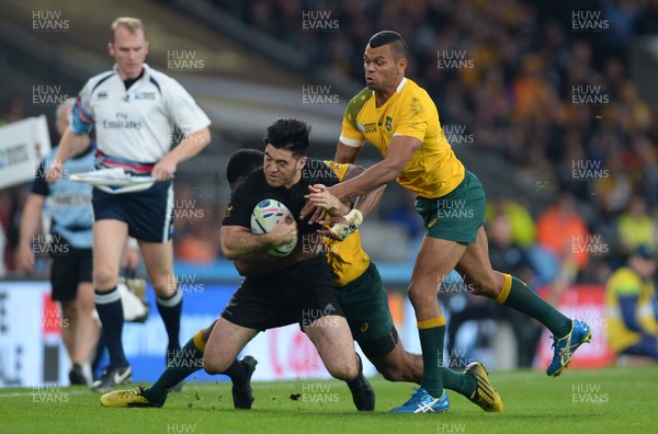 311015 - New Zealand v Australia - Rugby World Cup Final 2015 -Nehe Milner-Skudder of New Zealand is tackled by Tevita Kuridrani and Kurtley Beale of Australia