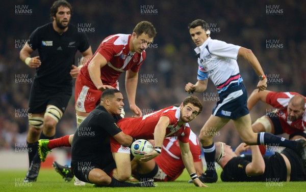 021015 - New Zealand v Fiji - Rugby World Cup 2015 -Vasil Lobjanidze of Georgia is tackled by Aaron Smith of New Zealand