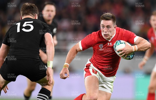 011119 - New Zealand v Wales - Rugby World Cup Bronze Final - Josh Adams of Wales is challenged by Beauden Barrett of New Zealand
