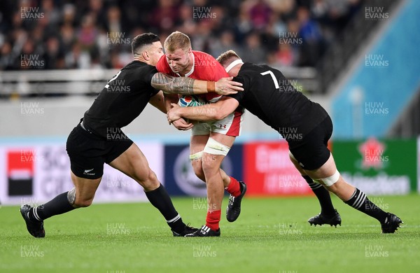 011119 - New Zealand v Wales - Rugby World Cup Bronze Final - Ross Moriarty of Wales is tackled by Sonny Bill Williams and Sam Cane of New Zealand