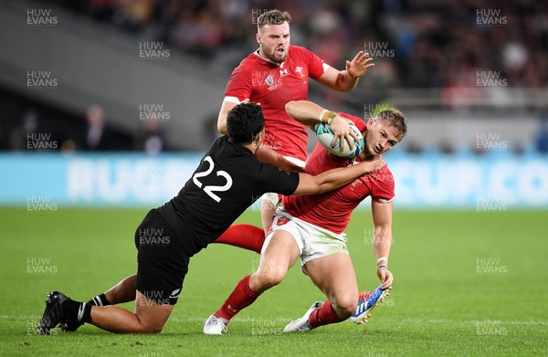 011119 - New Zealand v Wales - Rugby World Cup Bronze Final - Hallam Amos of Wales is tackled by Anton Lienert-Brown of New Zealand
