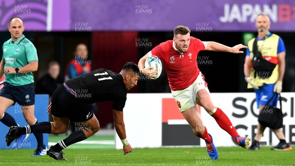 011119 - New Zealand v Wales - Rugby World Cup Bronze Final - Owen Lane of Wales gets past Rieko Ioane of New Zealand