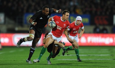 19.06.10 - New Zealand v Wales - 2010 Steinlager Series - Lee Byrne of Wales is tackled by Conrad Smith of New Zealand. 