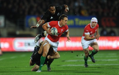 19.06.10 - New Zealand v Wales - 2010 Steinlager Series - Lee Byrne of Wales is tackled by Conrad Smith of New Zealand. 