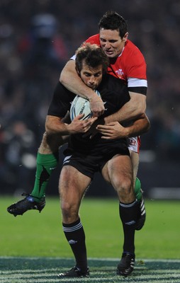 19.06.10 - New Zealand v Wales - 2010 Steinlager Series - Conrad Smith of New Zealand is tackled by Stephen Jones of Wales. 