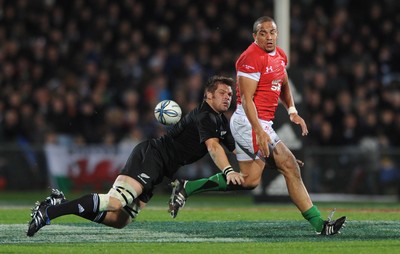 19.06.10 - New Zealand v Wales - 2010 Steinlager Series - Gavin Thomas of Wales is tackled by Richie McCaw of New Zealand. 