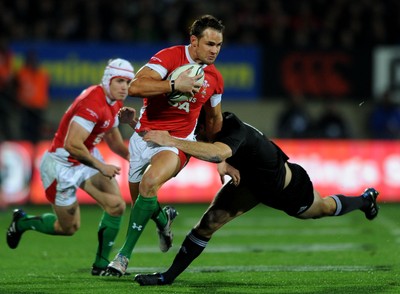19.06.10 - New Zealand v Wales - 2010 Steinlager Series - Lee Byrne of Wales is tackled by Conrad Smith of New Zealand. 
