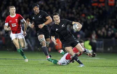 19.06.10 - New Zealand v Wales - 2010 Steinlager Series - Dan Carter beats tackle by Andrew Bishop. 