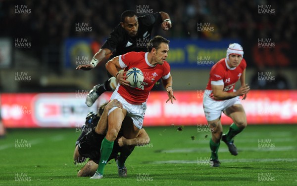 19.06.10 - New Zealand v Wales - 2010 Steinlager Series - Lee Byrne of Wales is tackled by Conrad Smith of New Zealand. 