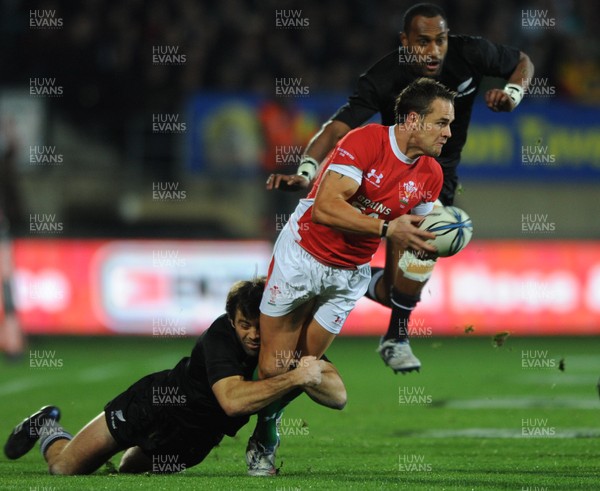 19.06.10 - New Zealand v Wales - 2010 Steinlager Series - Lee Byrne of Wales is tackled by Conrad Smith of New Zealand. 