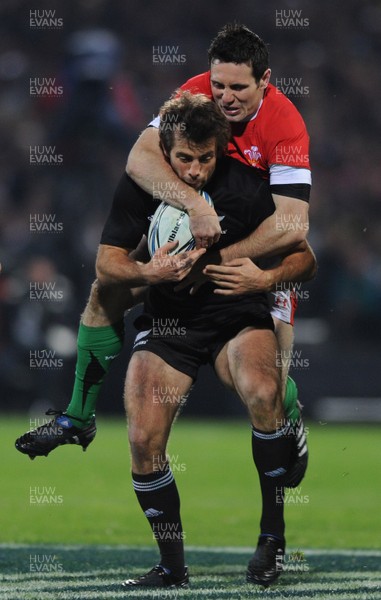 19.06.10 - New Zealand v Wales - 2010 Steinlager Series - Conrad Smith of New Zealand is tackled by Stephen Jones of Wales. 